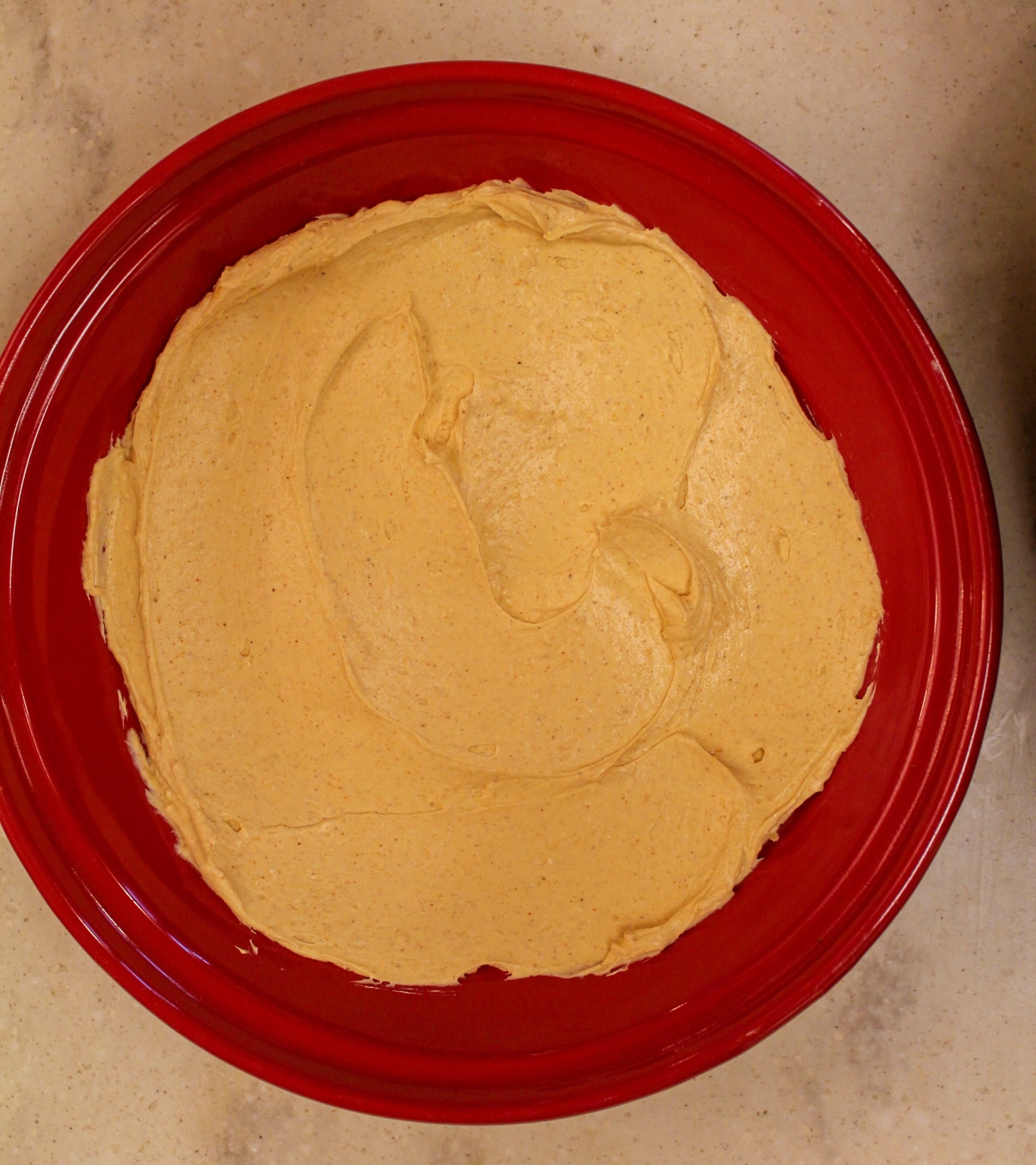 taco dip overhead shot in red plate