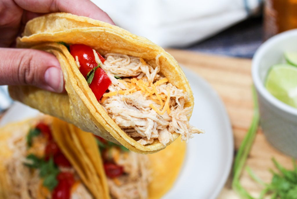 Holding a chicken taco
