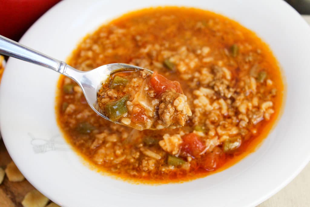 stuffed pepper in a bow with a spoon