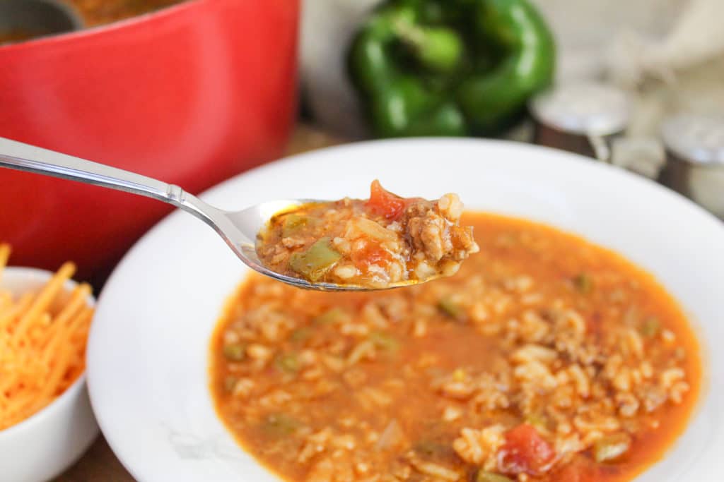 stuffed pepper in a bow with a spoon