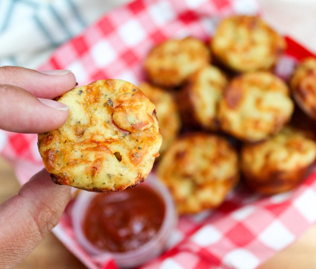 pizza muffin being held