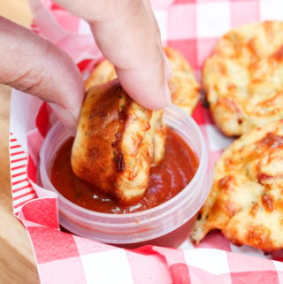 pizza muffin dipped in sauce