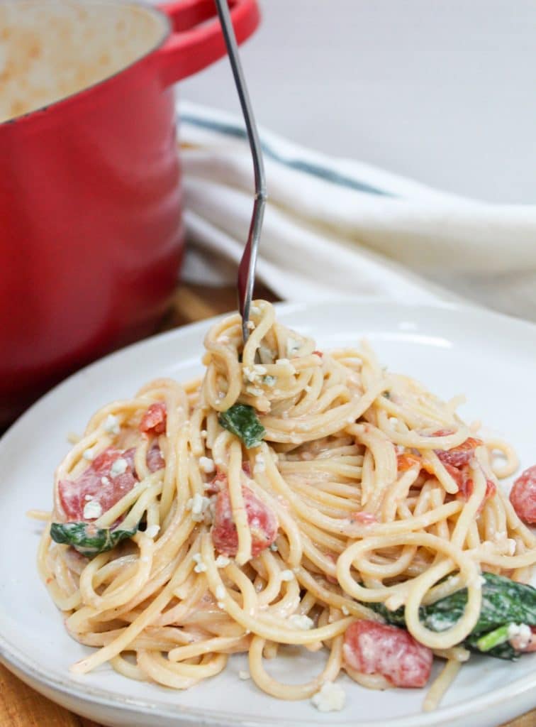 blue cheese and tomato pasta with fork