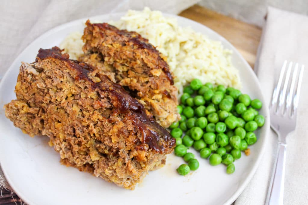 sliced meatloaf on a white plate