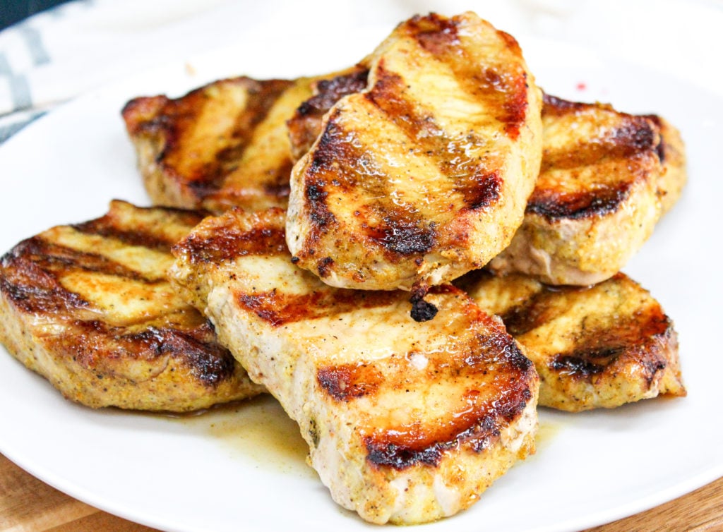 Pork chops on a white plate
