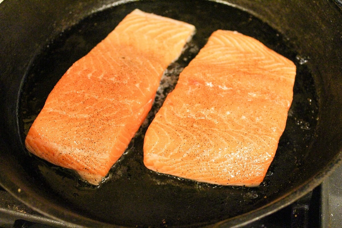 salmon cooking in a pan