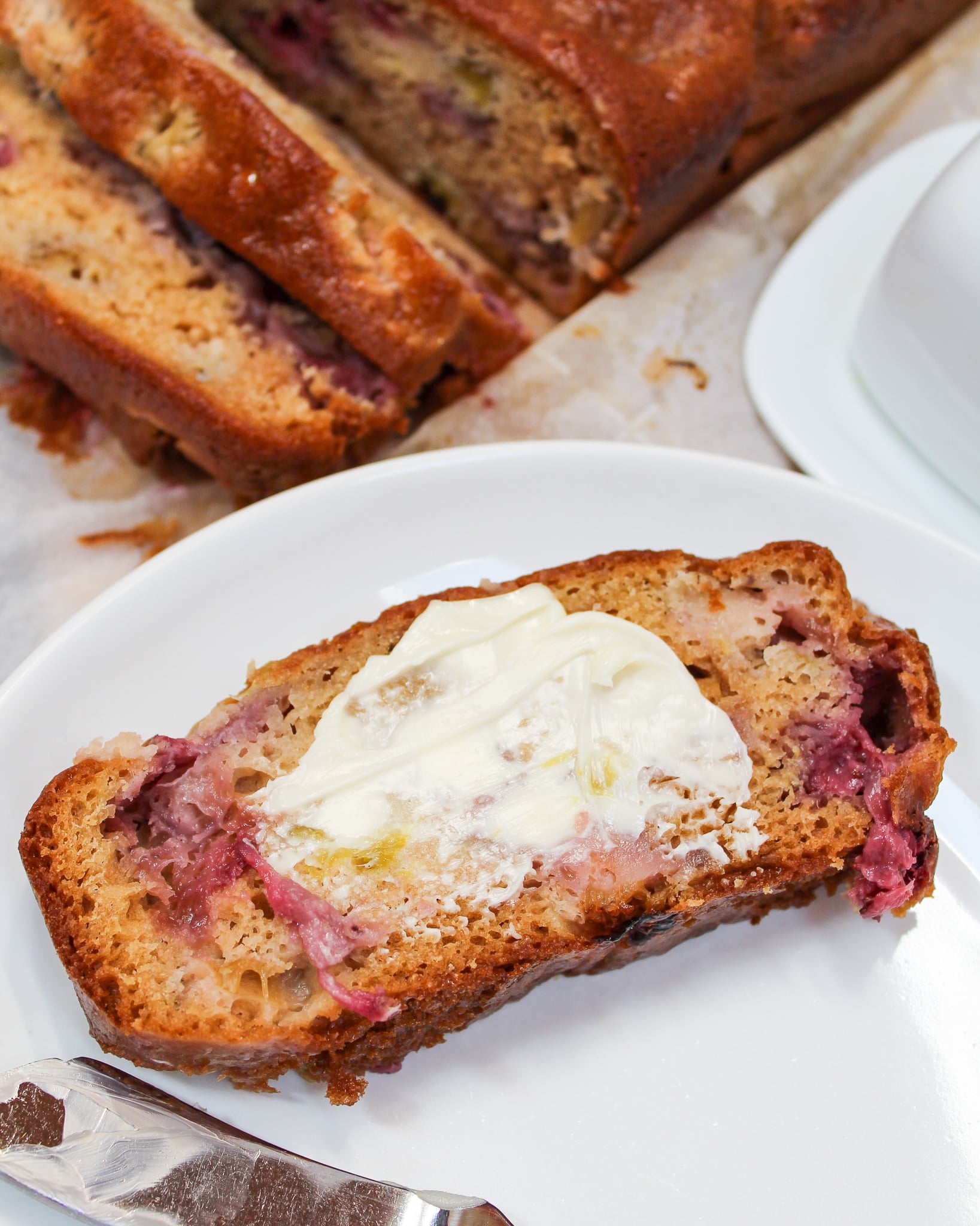 slice of bread on a plate with butter