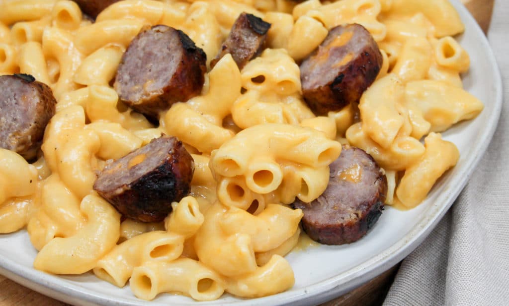 pasta and brats on a plate