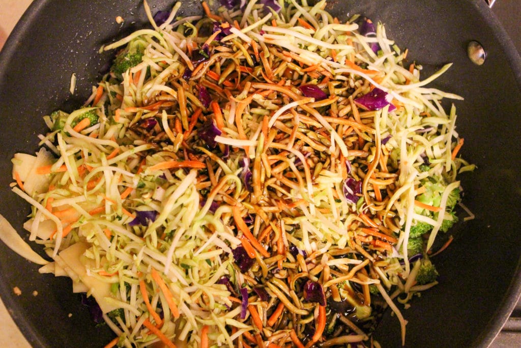 broccoli slaw and sauce in pan