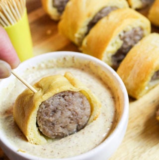sliced bites on a cutting board with dip