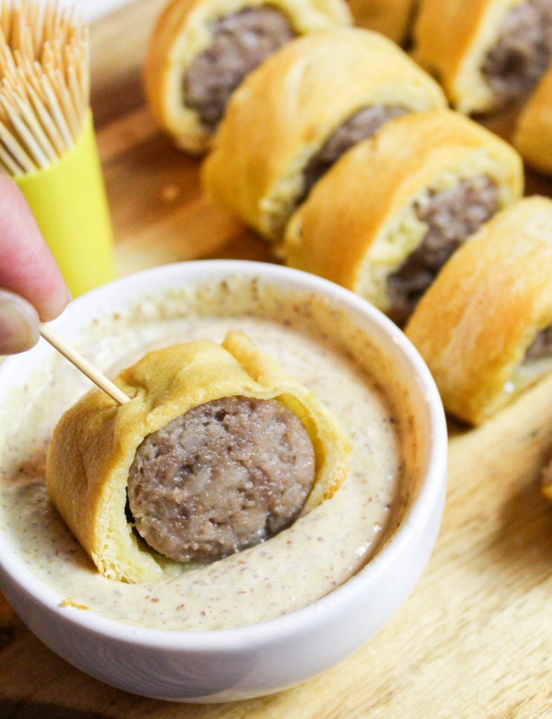 sliced bites on a cutting board with dip