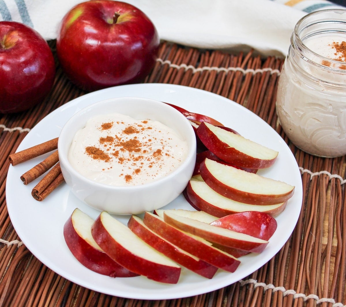 apple cider dip in a bowl with sliced apples