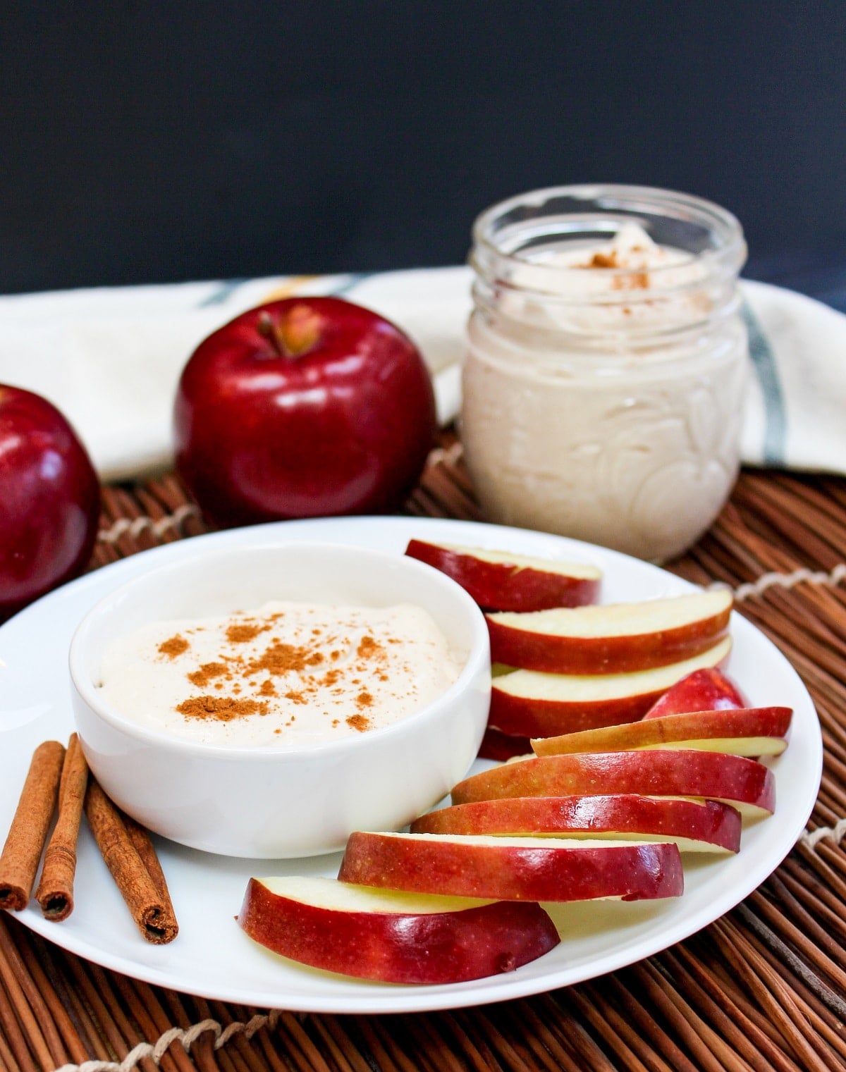 apple cider dip in a bowl with sliced apples