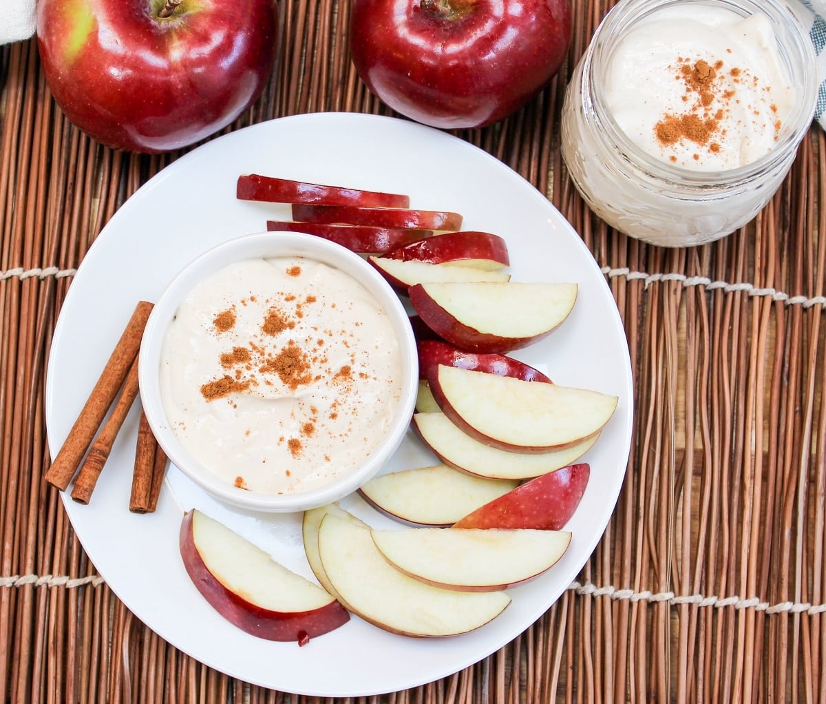 apple cider dip in a bowl with sliced apples