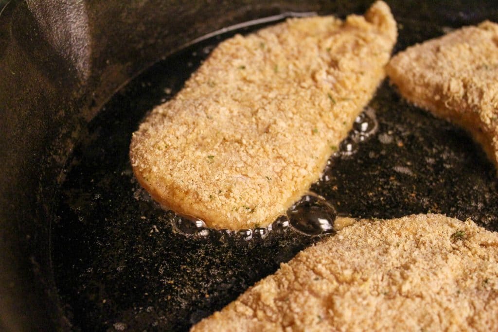 chicken cooking in a pan