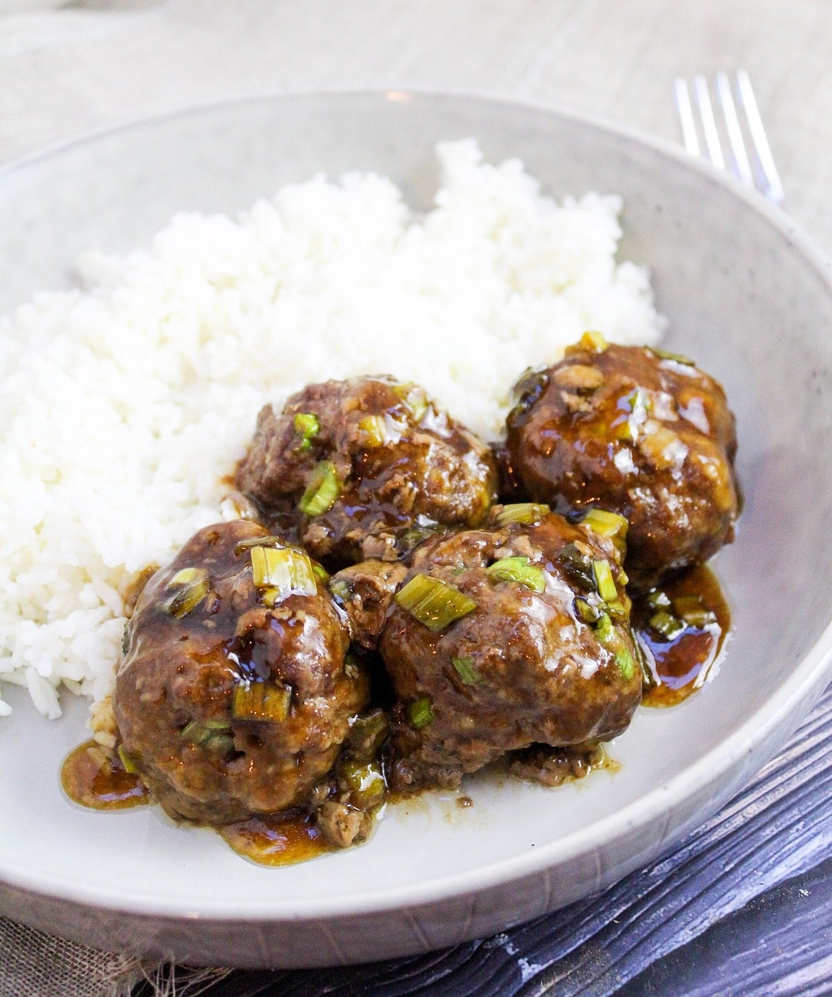 cooked meatballs in dish with rice