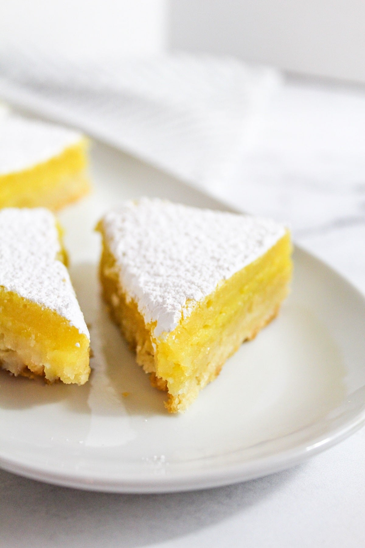 meyer lemon bars on a plate