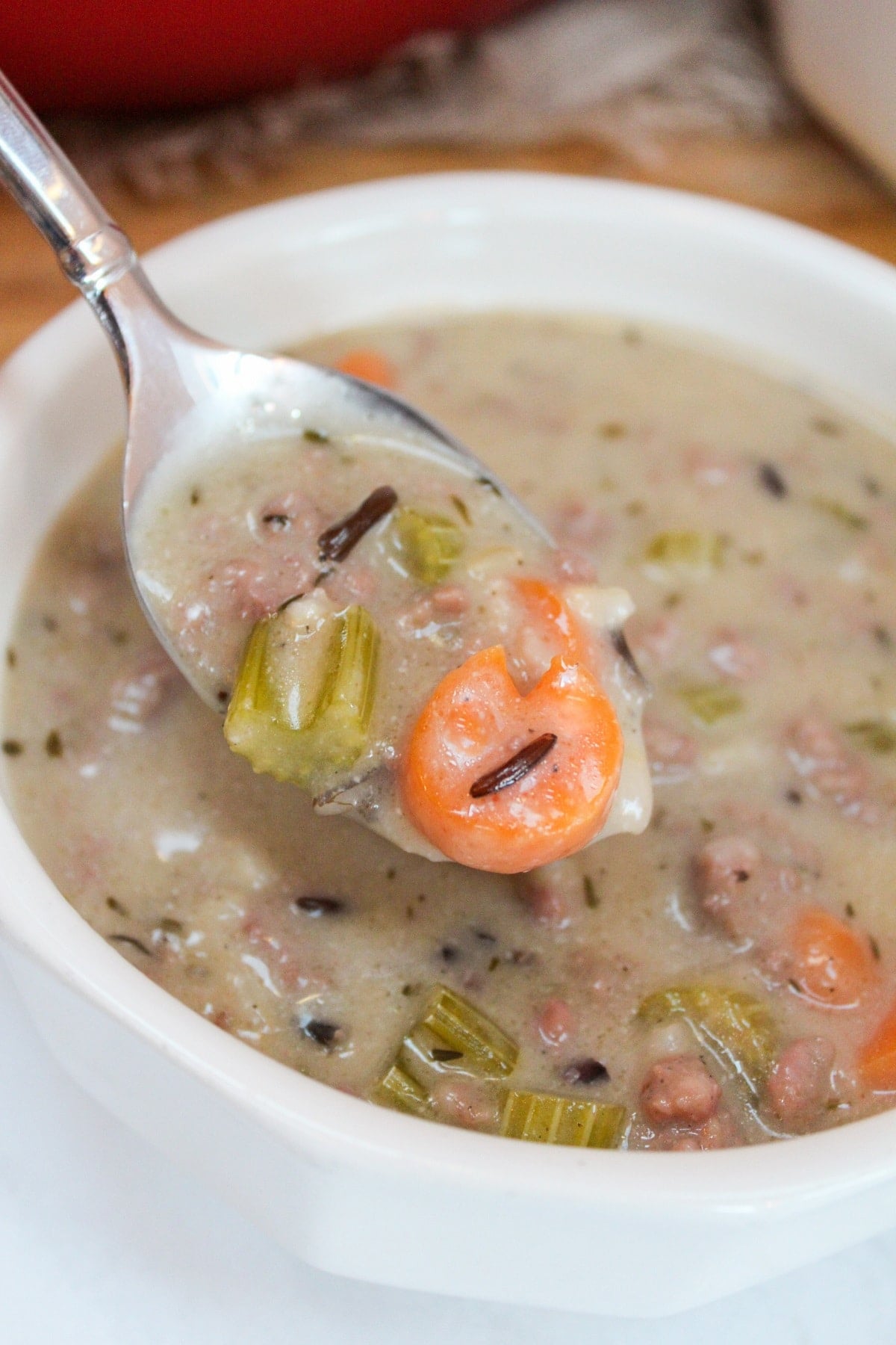 Creamy Wild Rice and Sausage Soup on a spoon