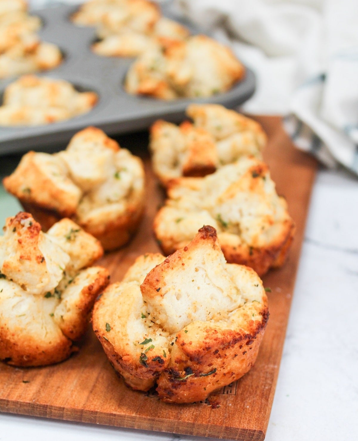 Garlic monkey bread on a wood tray