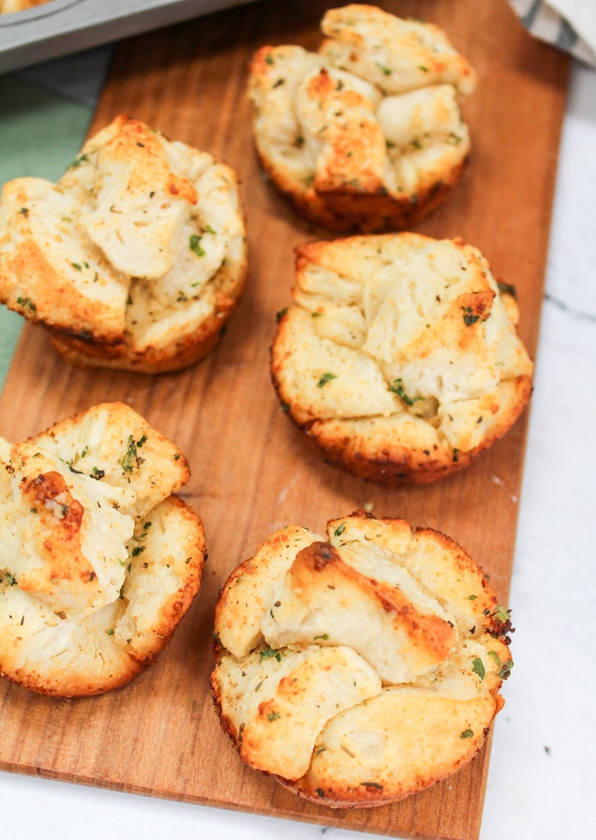 Garlic monkey bread on a wood tray