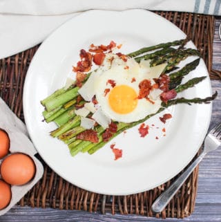 overhead shot of egg and asparagus salad on a plate