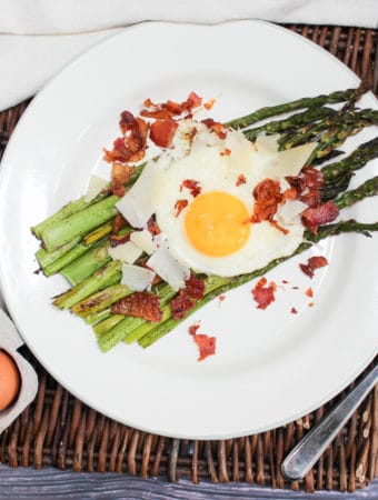 overhead shot of egg and asparagus salad on a plate