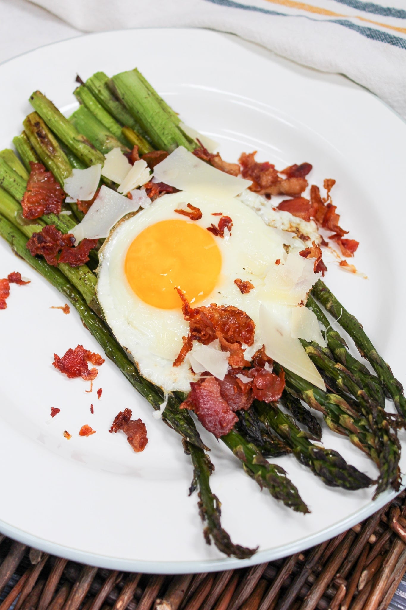 overhead shot of egg and asparagus salad on a plate