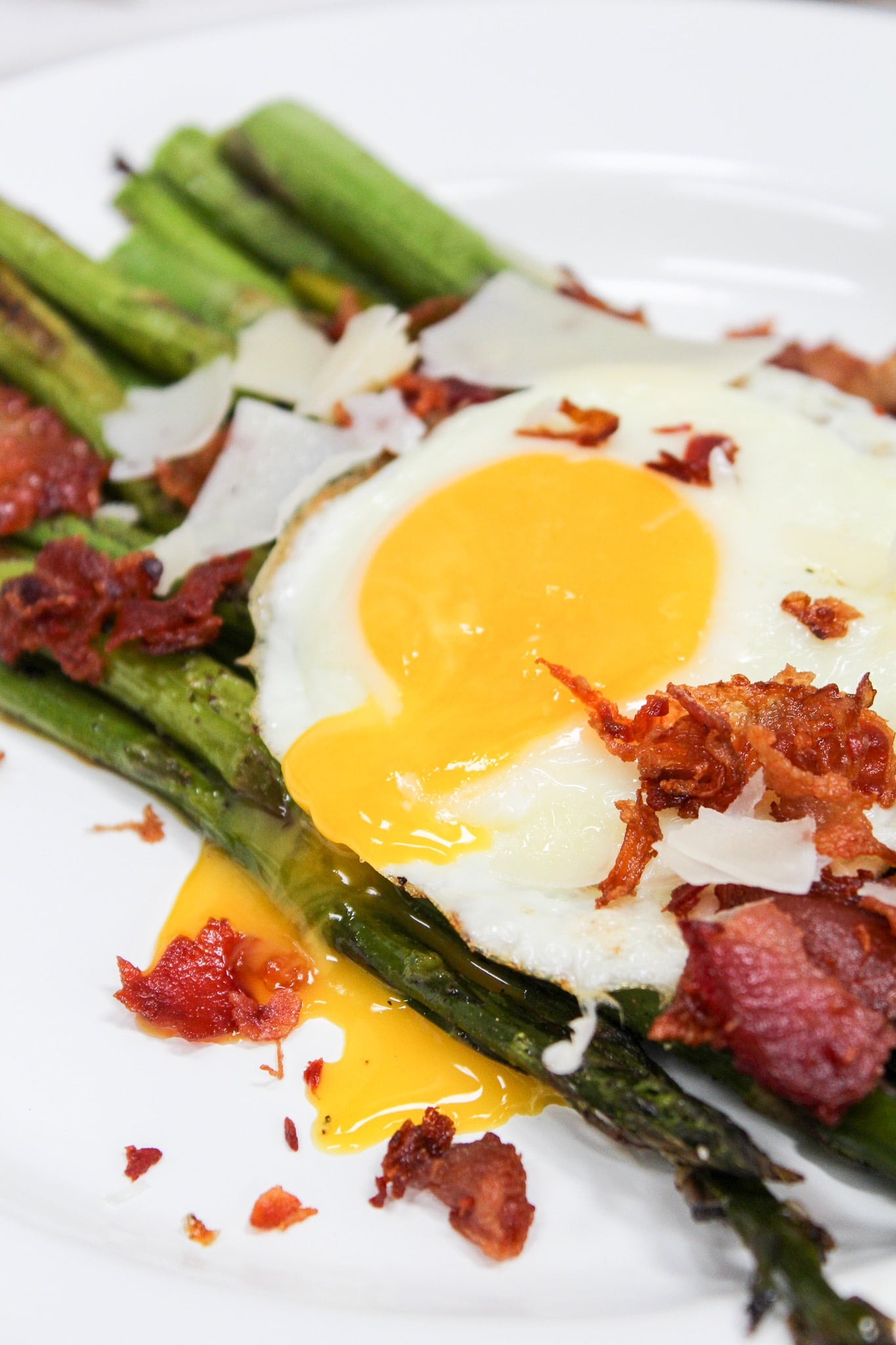 close up shot of asparagus salad with egg yolk broker