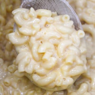 mac and cheese on a wooden spoon