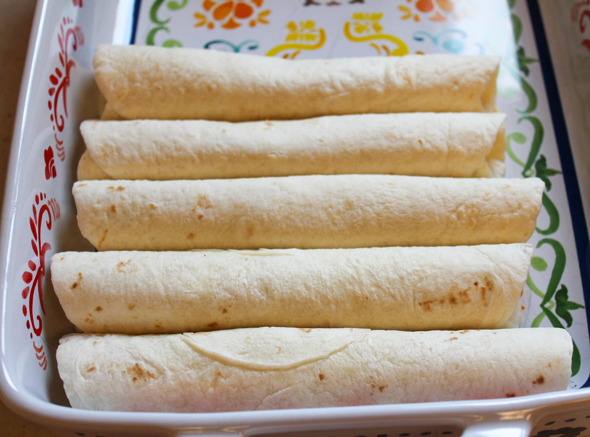 enchiladas in a baking dish with no sauce
