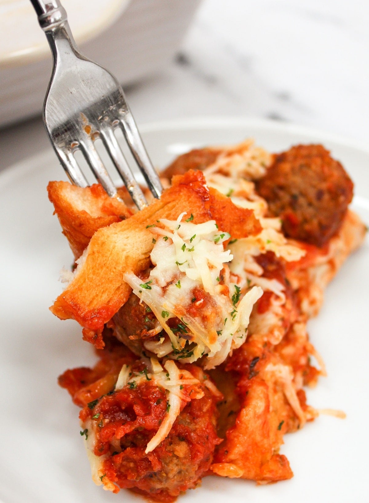 meatball sub casserole with a fork