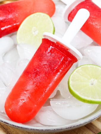 Popsicle over ice with limes