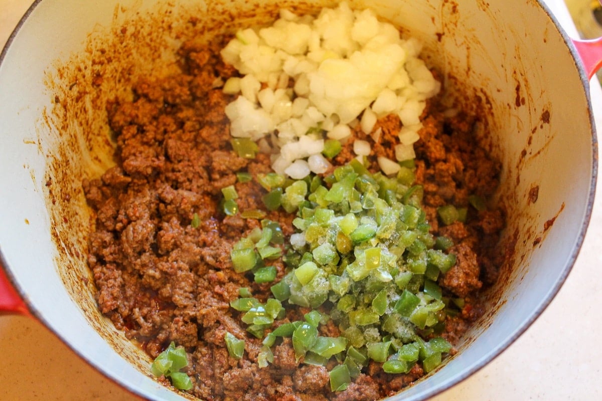chili preparation in a pot with tomato sauce