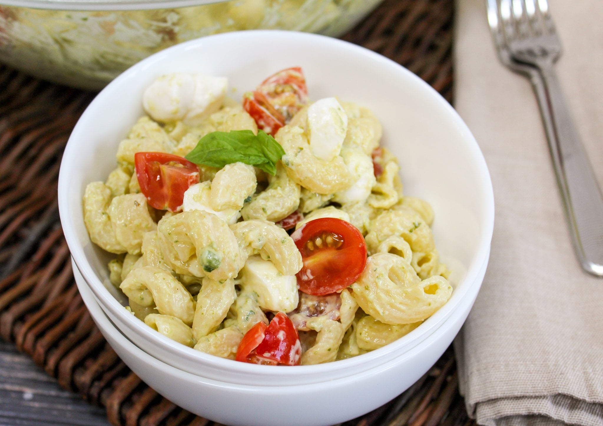 pasta salad in white individual bowls