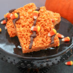 candy corn treat on a black plate