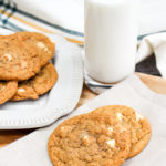 pumpkin cookies on a plate with milk