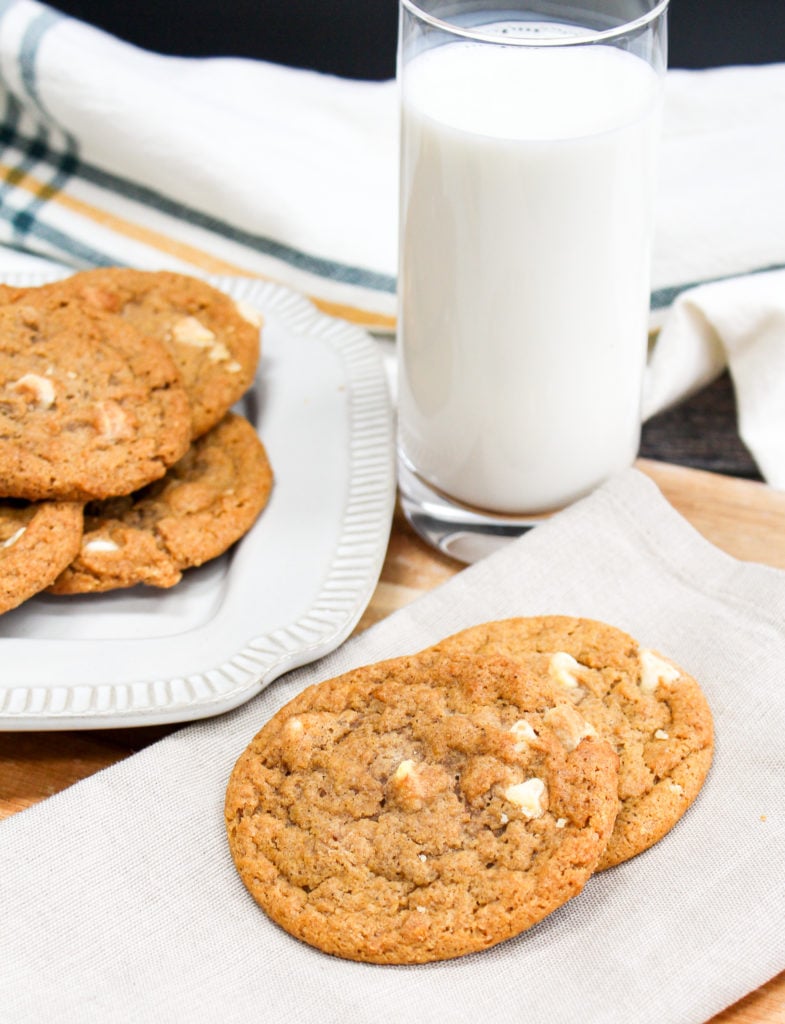 pumpkin cookies on a plate with milk