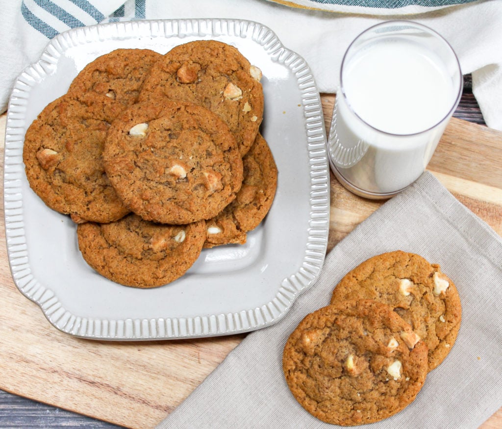 pumpkin cookies on a plate with milk