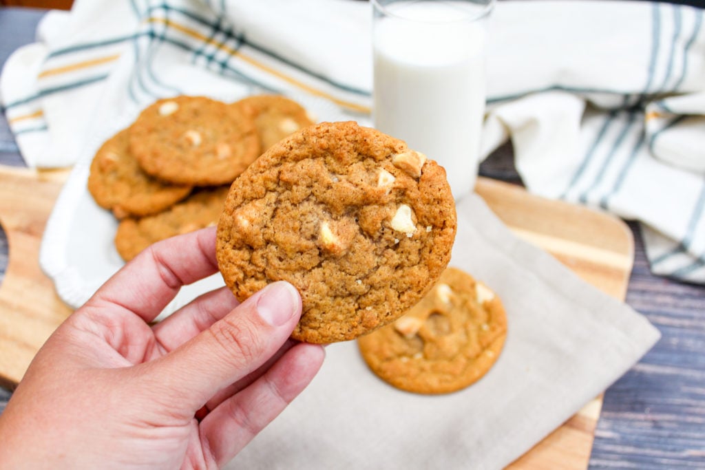 pumpkin cookies held in hand
