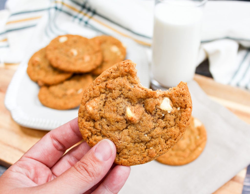 pumpkin cookies held in hand