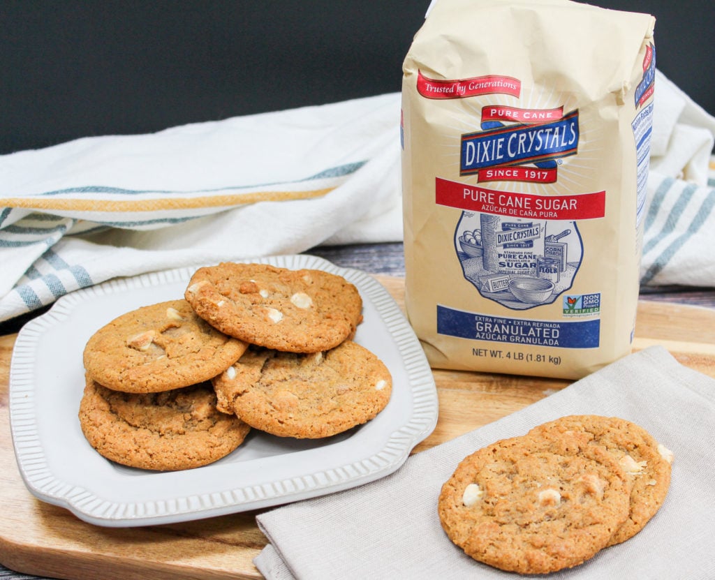 pumpkin cookies on a plate with milk