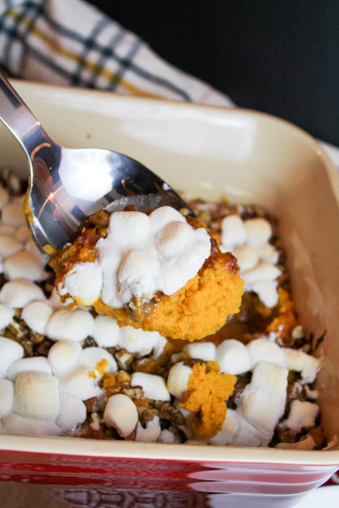 sweet potato casserole scooped from a baking dish