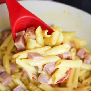 Ham and Cheese Pasta scooped from the pot with a spoon