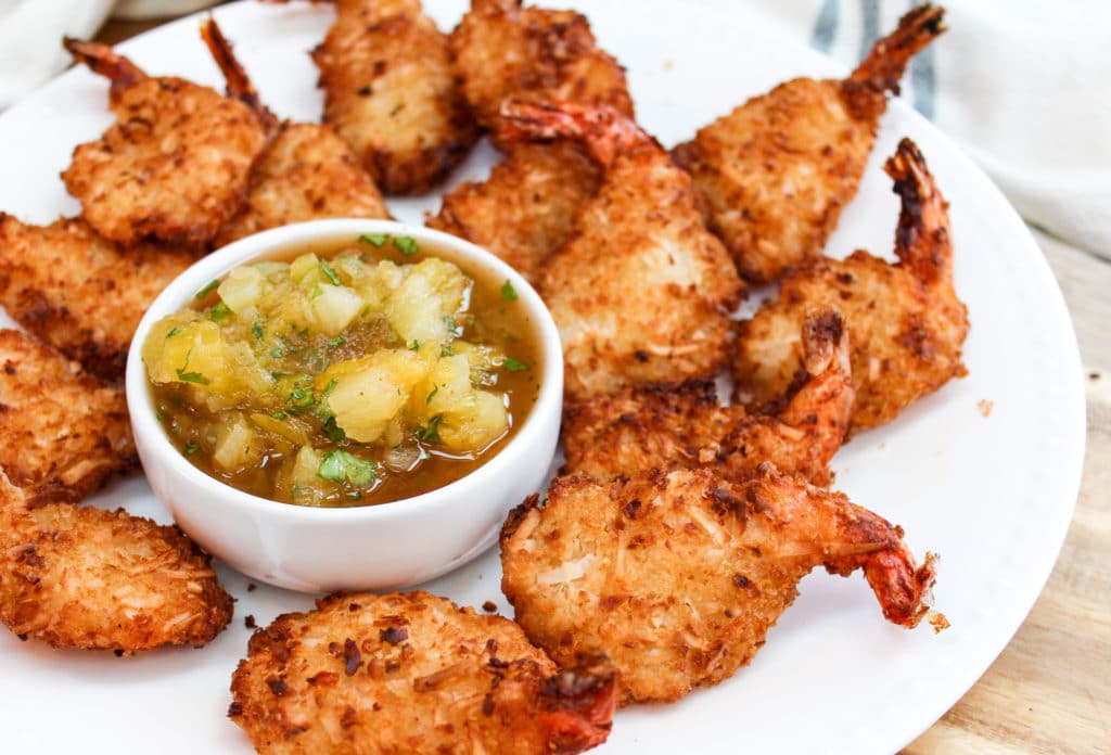 shrimp on a plate with salsa