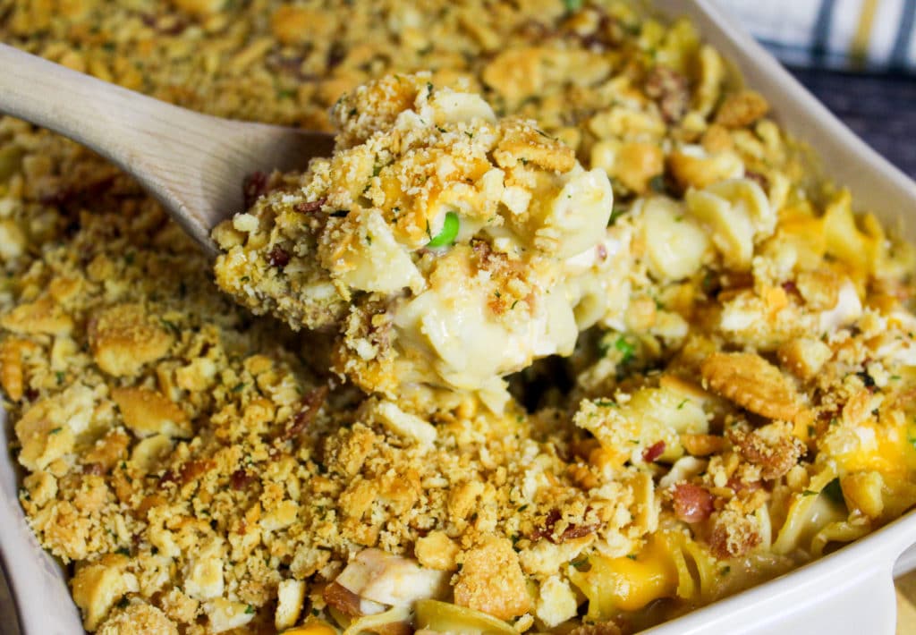 Casserole scooped on a wooden spoon