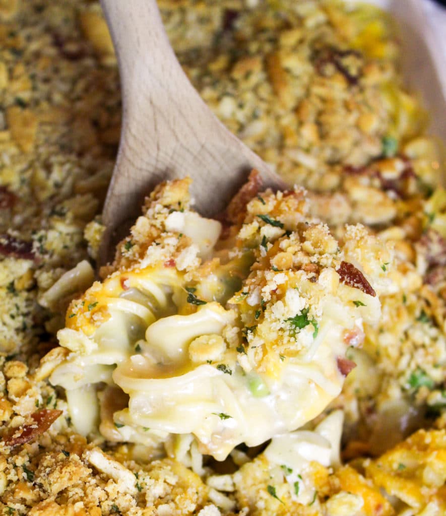 Casserole scooped on a wooden spoon
