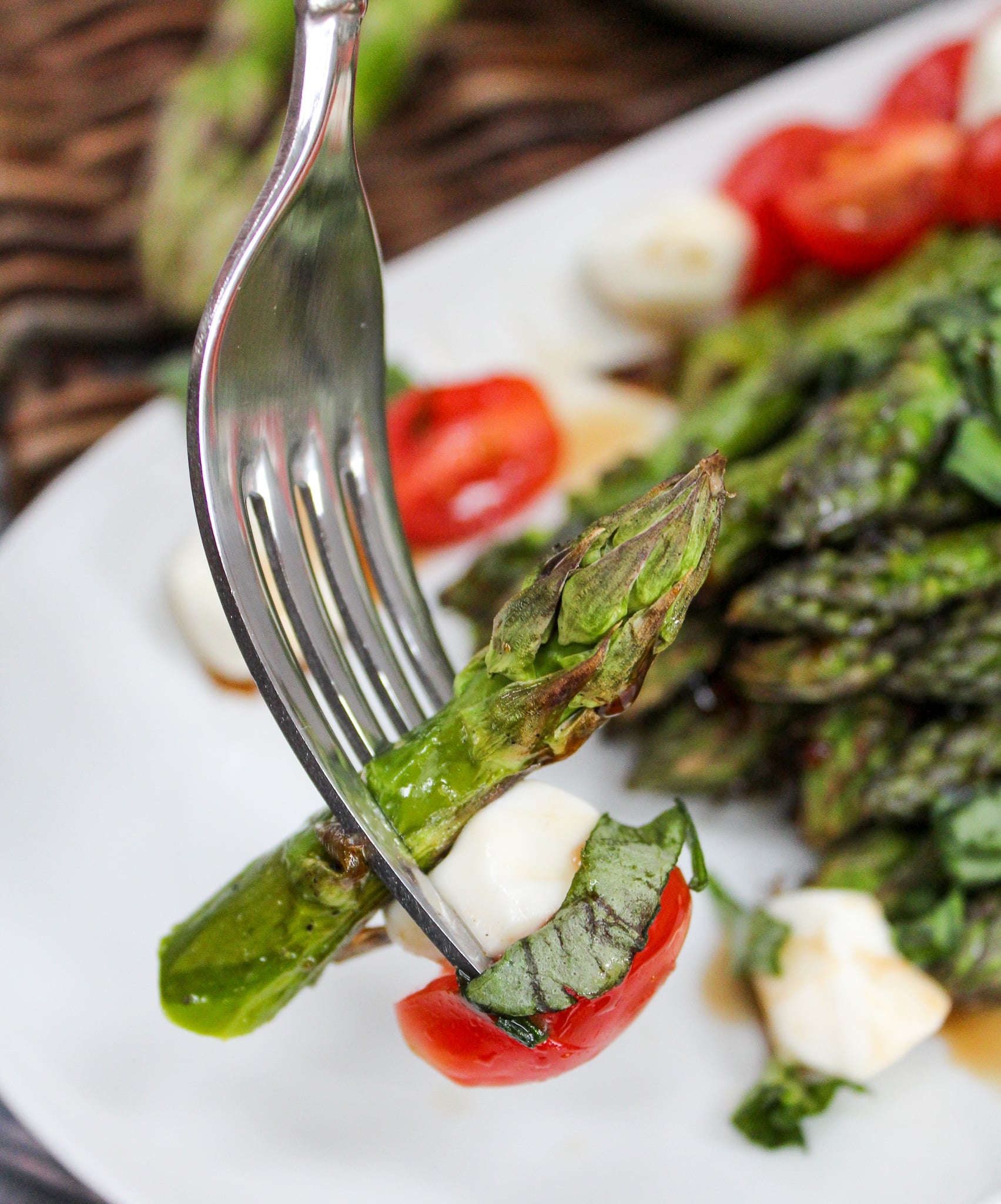 Grilled Asparagus Caprese Salad on a fork