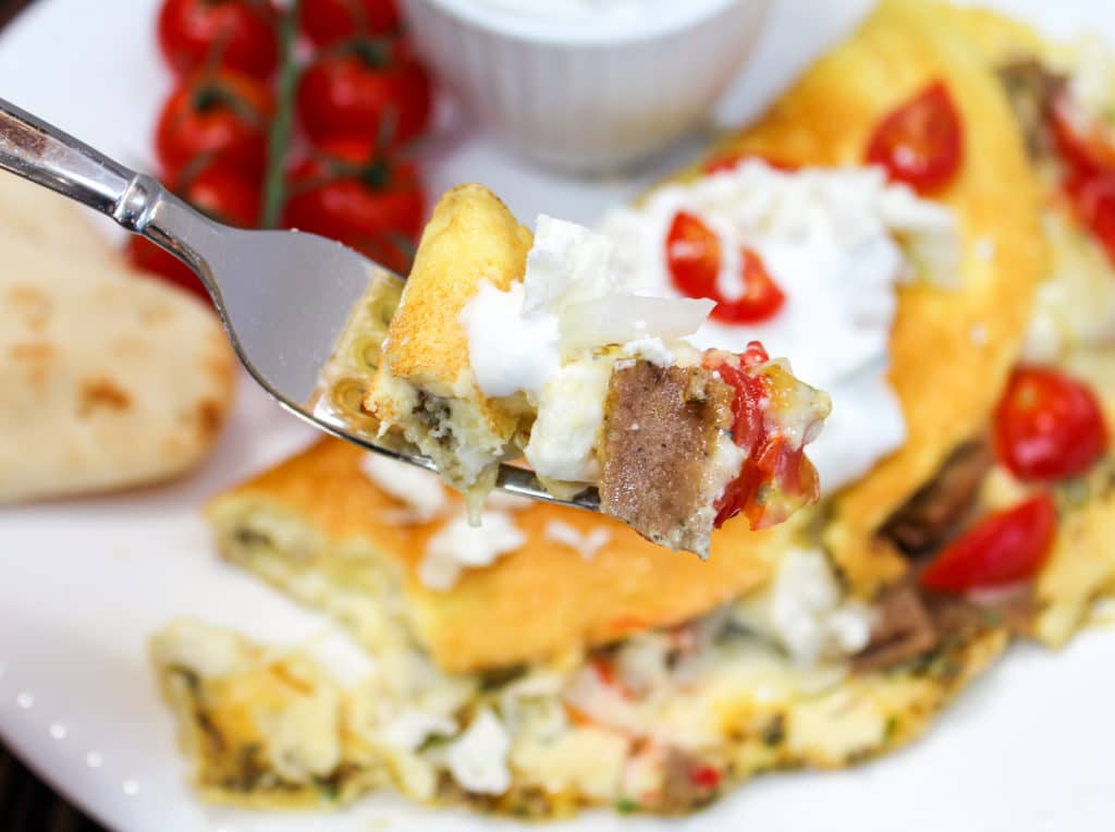 omelette on a plate with fork