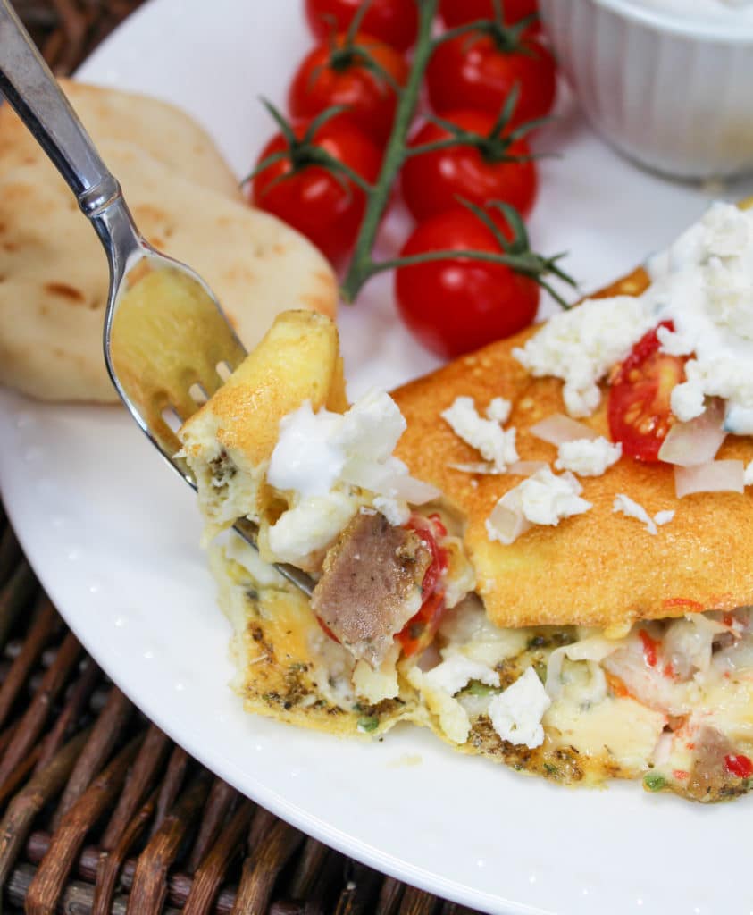 omelette on a plate with fork