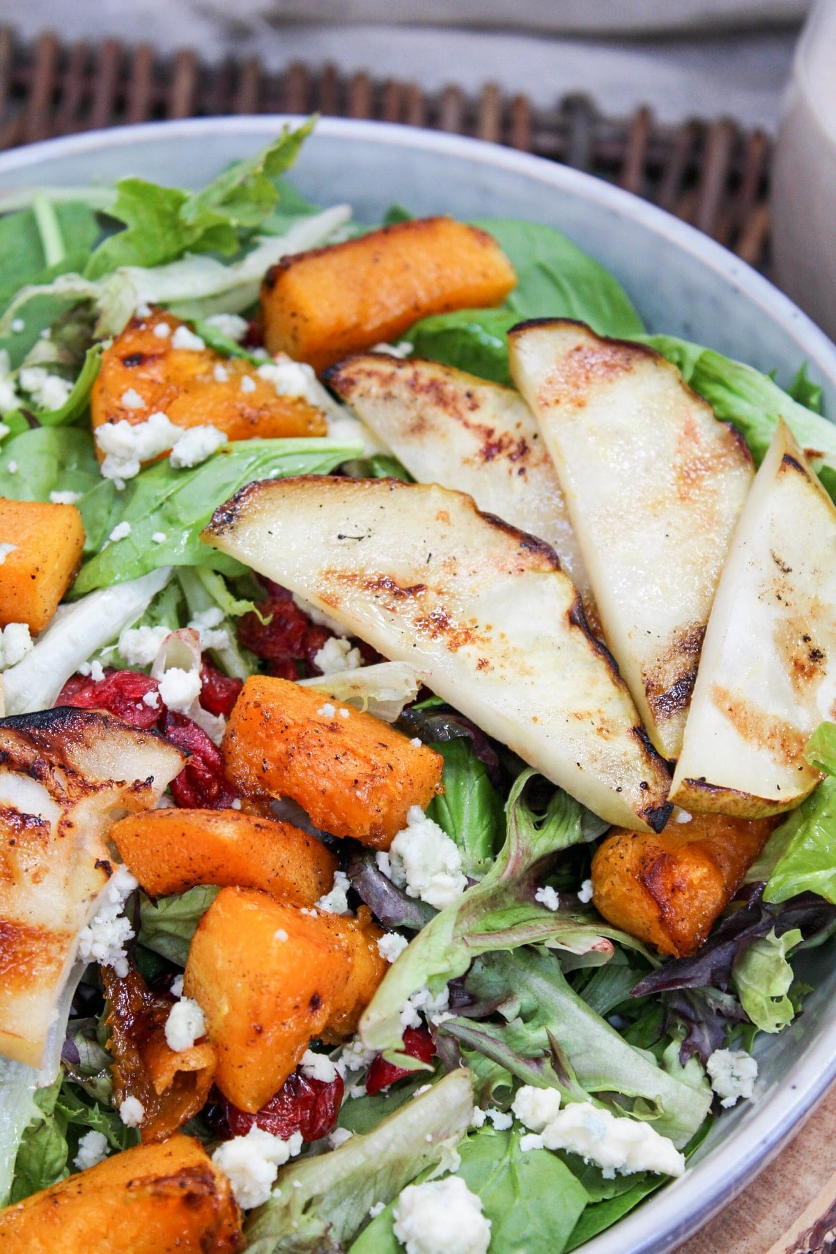 salad in a bowl with grilled pears